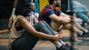 a group of people sitting on yoga mats