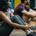 a group of people sitting on yoga mats